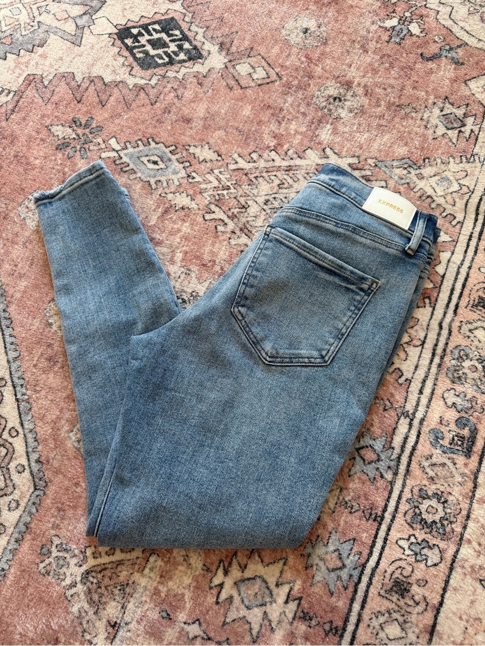 Express Women's Skinny Jeans in Mid Blue Wash, Distressed Details (Size 8R)